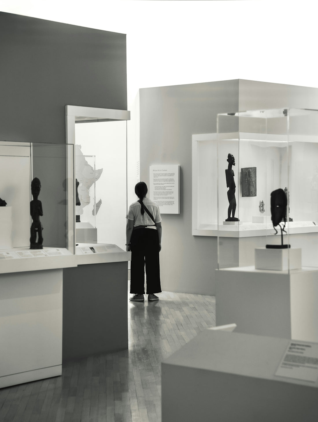A person views art in a gallery.