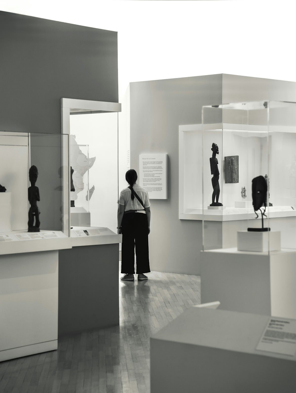 A person views art in a gallery.
